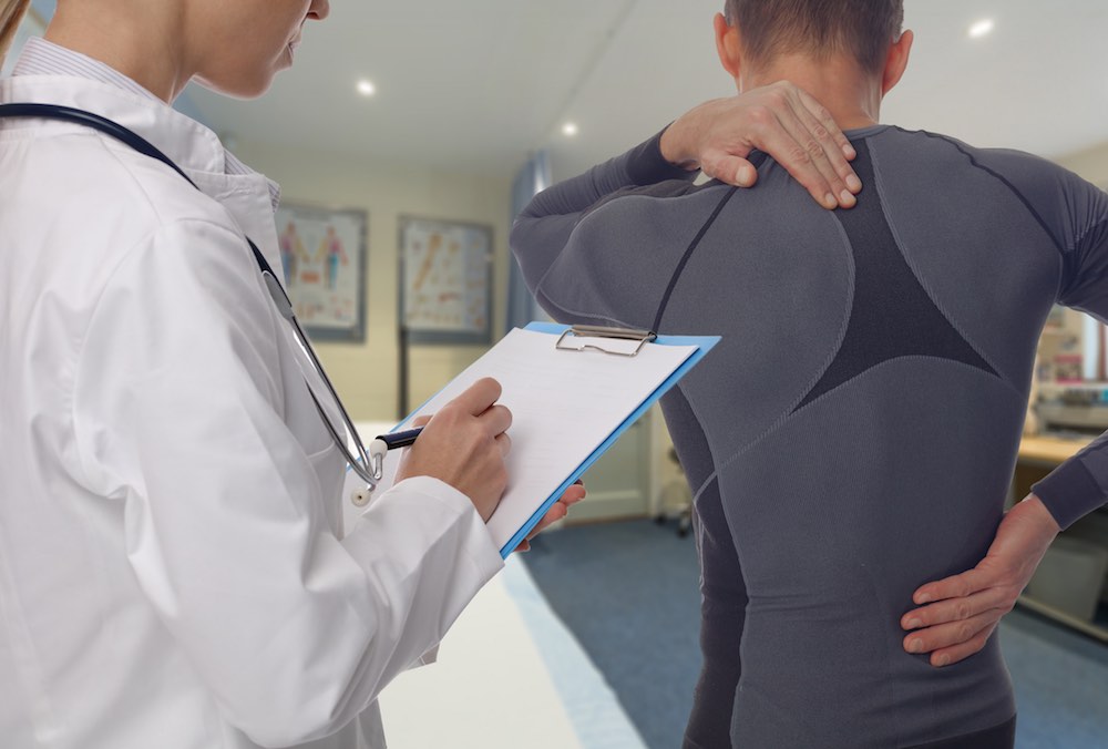 Chiropractic, osteopathy, Physiotherapy, sport injury rehabilitation. Alternative medicine, pain relief concept. Man patient suffering from back pain during medical exam